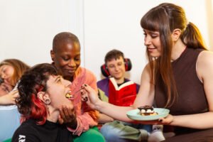 Friends enjoying dessert and reading together