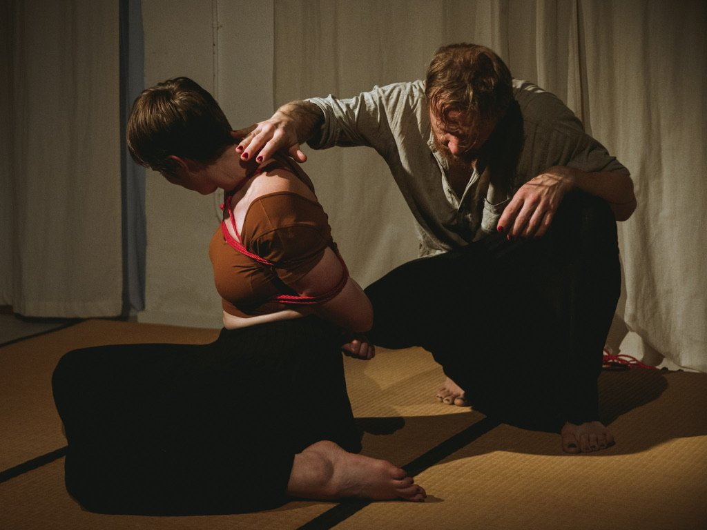 Barkas ties Addie in shibari rope bondage in an artistic way