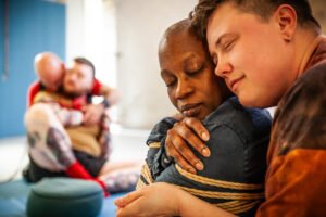 People embracing and sharing a moment of connection.