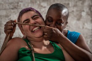 Two people sharing a playful moment with rope.