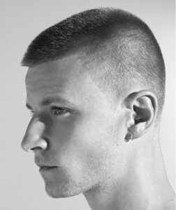 Man with buzz cut in side profile