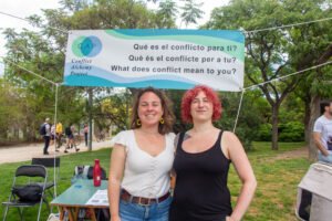 Two people under a conflict discussion banner